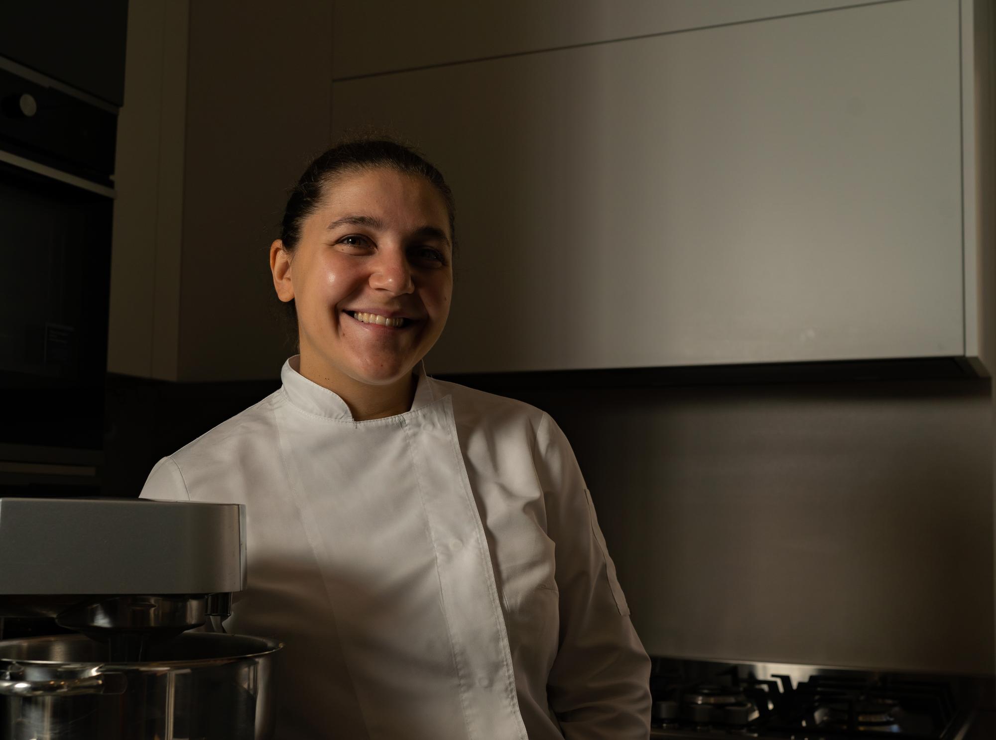 Local chef smiling in kitchen studio